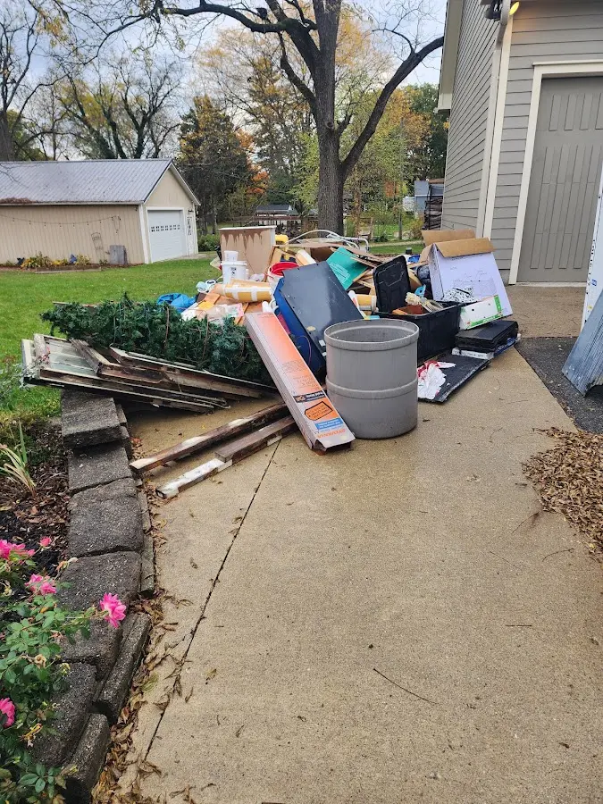 Dumpster being loaded with debris for 12 Yard Dumpster Rental in Monterey Park